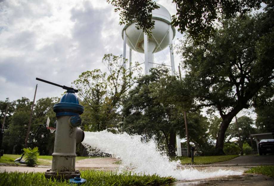 Water is flushed from a fire hydrant in Lake Jackson over the discovery that a brain-eating amoeba tainted the water supply. Photo: Marie D. De Jesús, Houston Chronicle / Staff Photographer / © 2020 Houston Chronicle