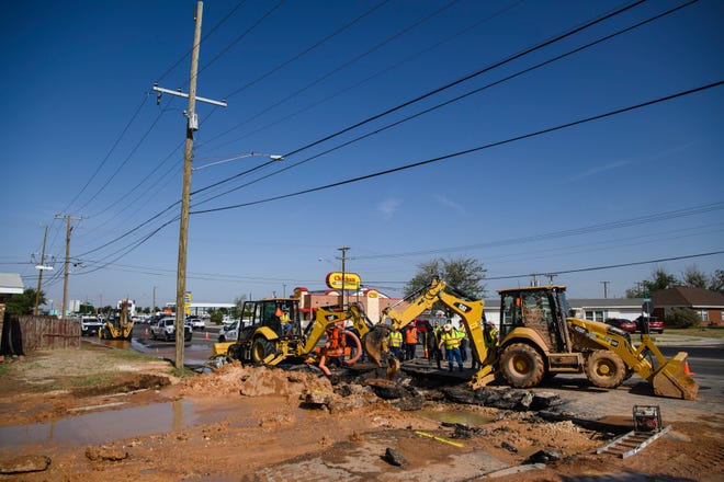 City of Odessa Water Distribution crews work to repair a damaged water main that left the majority of Ector County with little to no clean running water Tuesday, June 14, 2022, in Odessa, Texas.