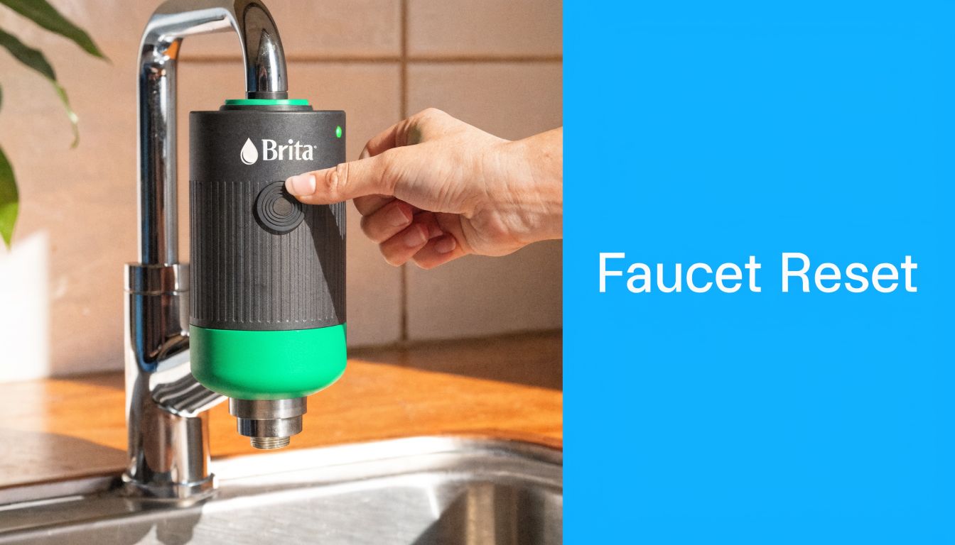 A hand presses the reset button on a Brita faucet-mounted water filtration system over a kitchen sink.