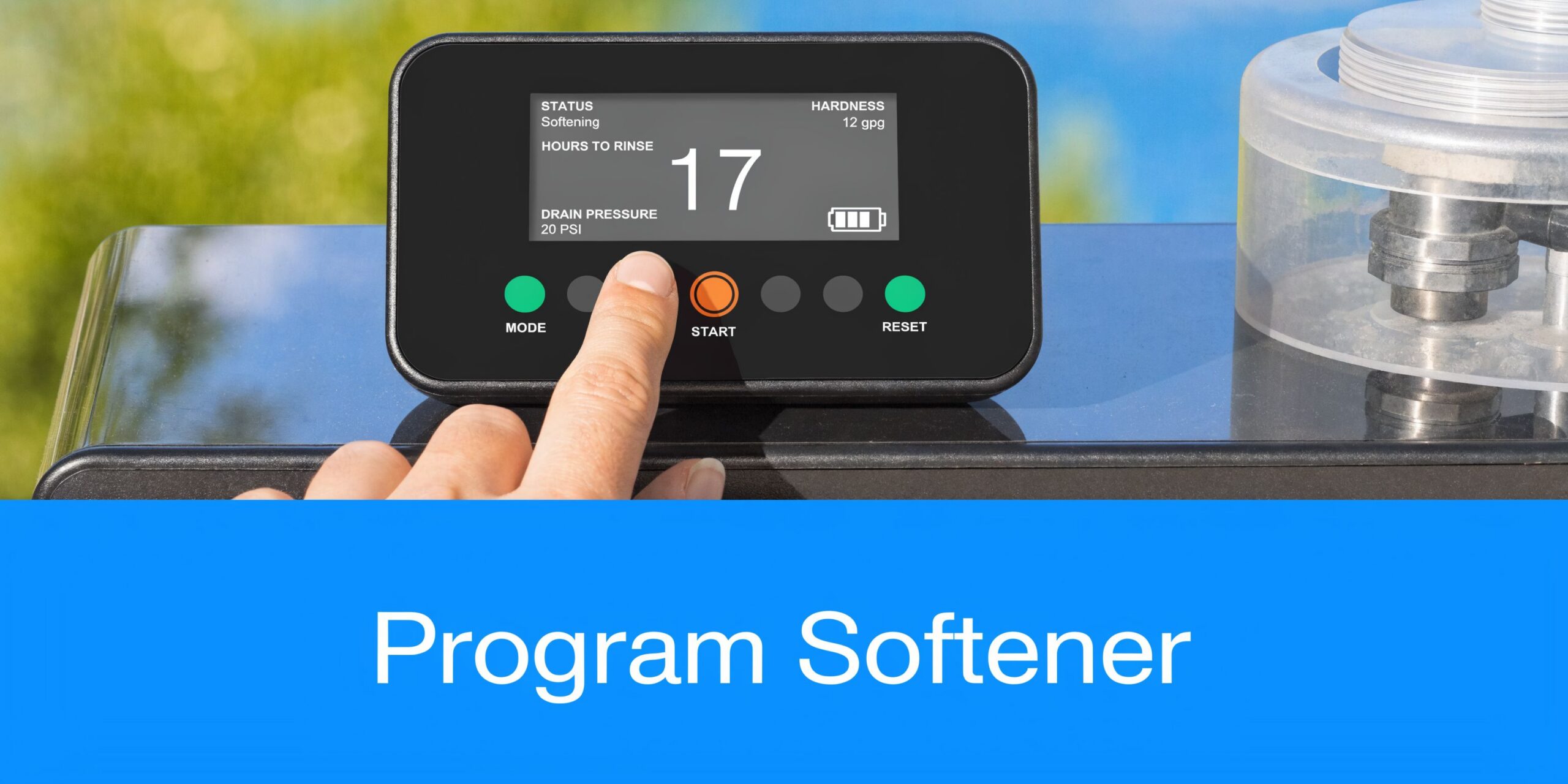 A close-up of a person's finger adjusting the digital settings on a home water softener control panel.