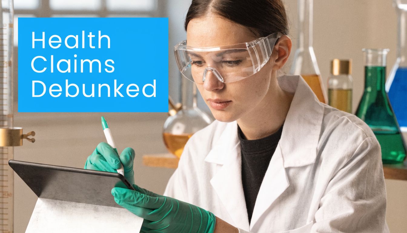 A scientist in a laboratory wearing protective gear while checking data on a digital tablet device.