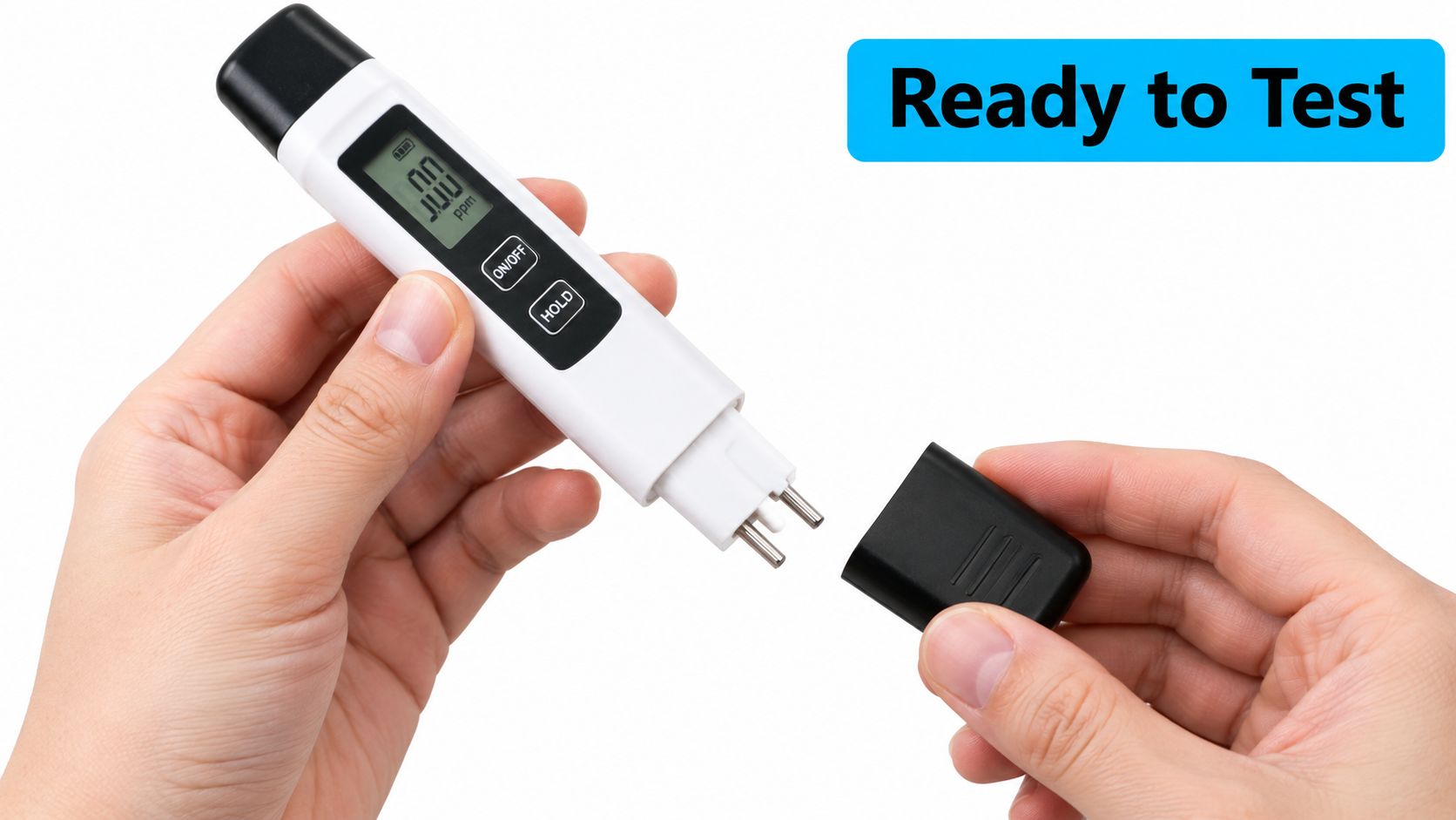 A person holding a white digital TDS water tester with the protective cap removed and ready to use.
